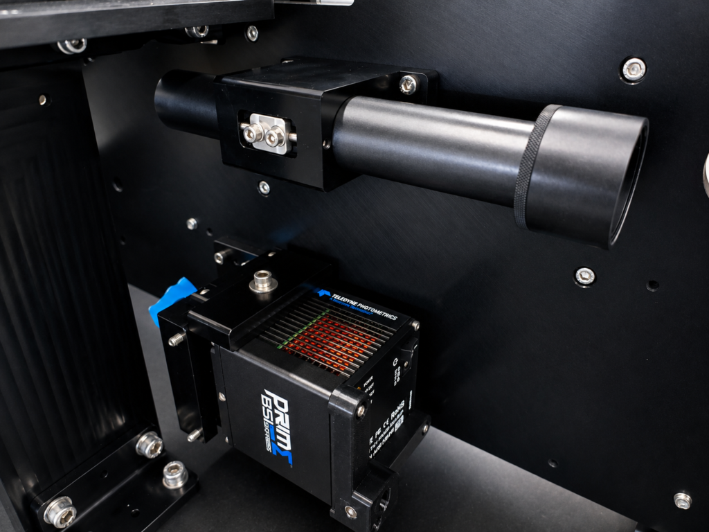 A close-up image of optical and imaging components integrated within a complex imaging-based instrument.